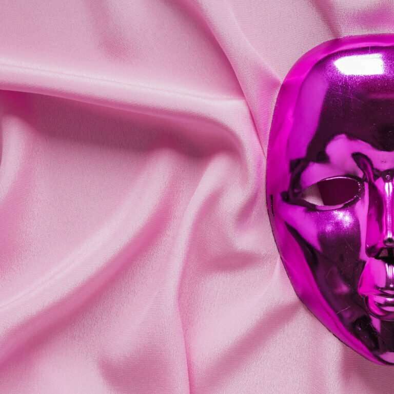 close up carnival mask pink fabric